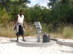 A well prior to the installation of roof and surround to protect from the sun and animals